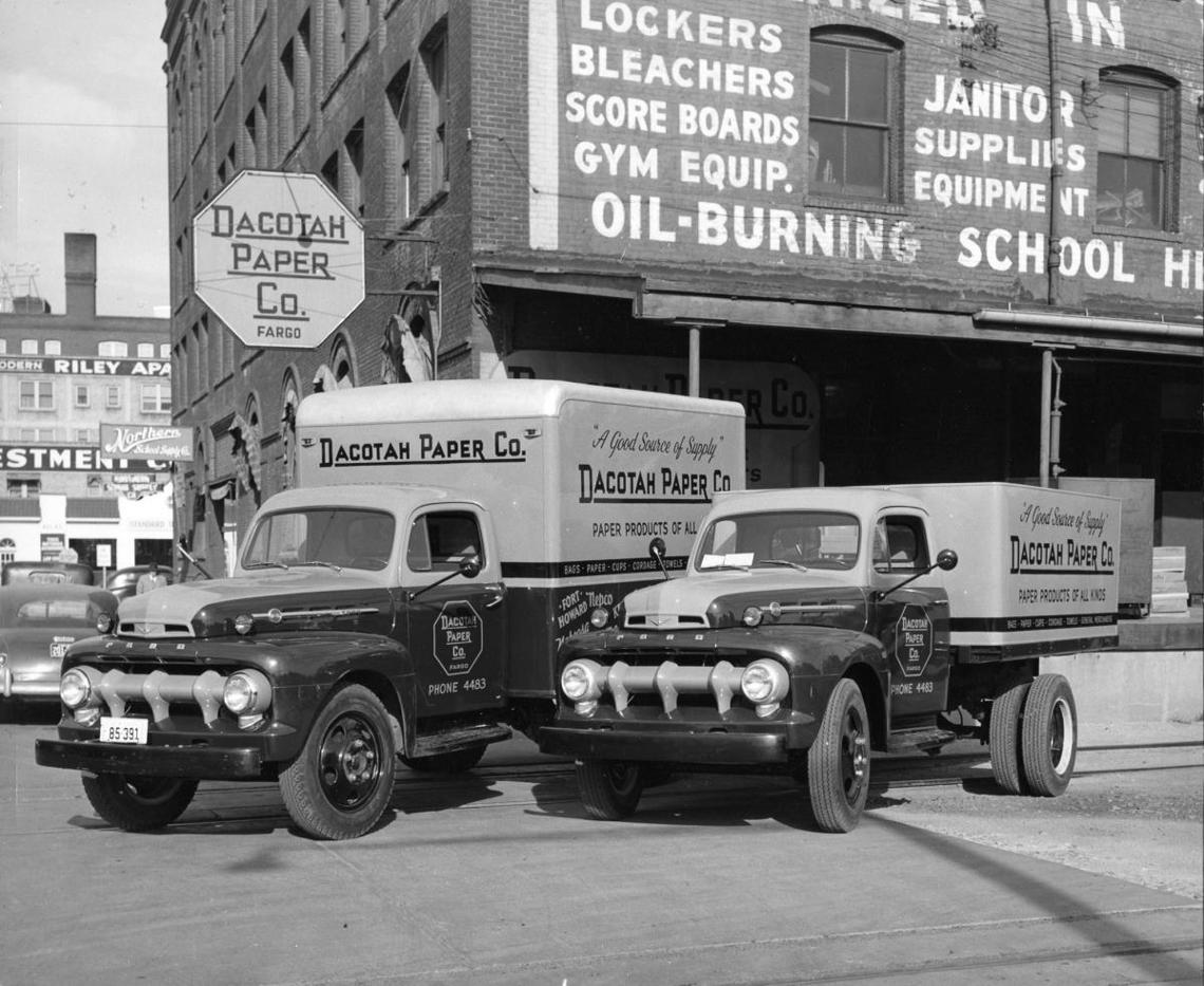 Trucks in front of Dacotah Paper Co.